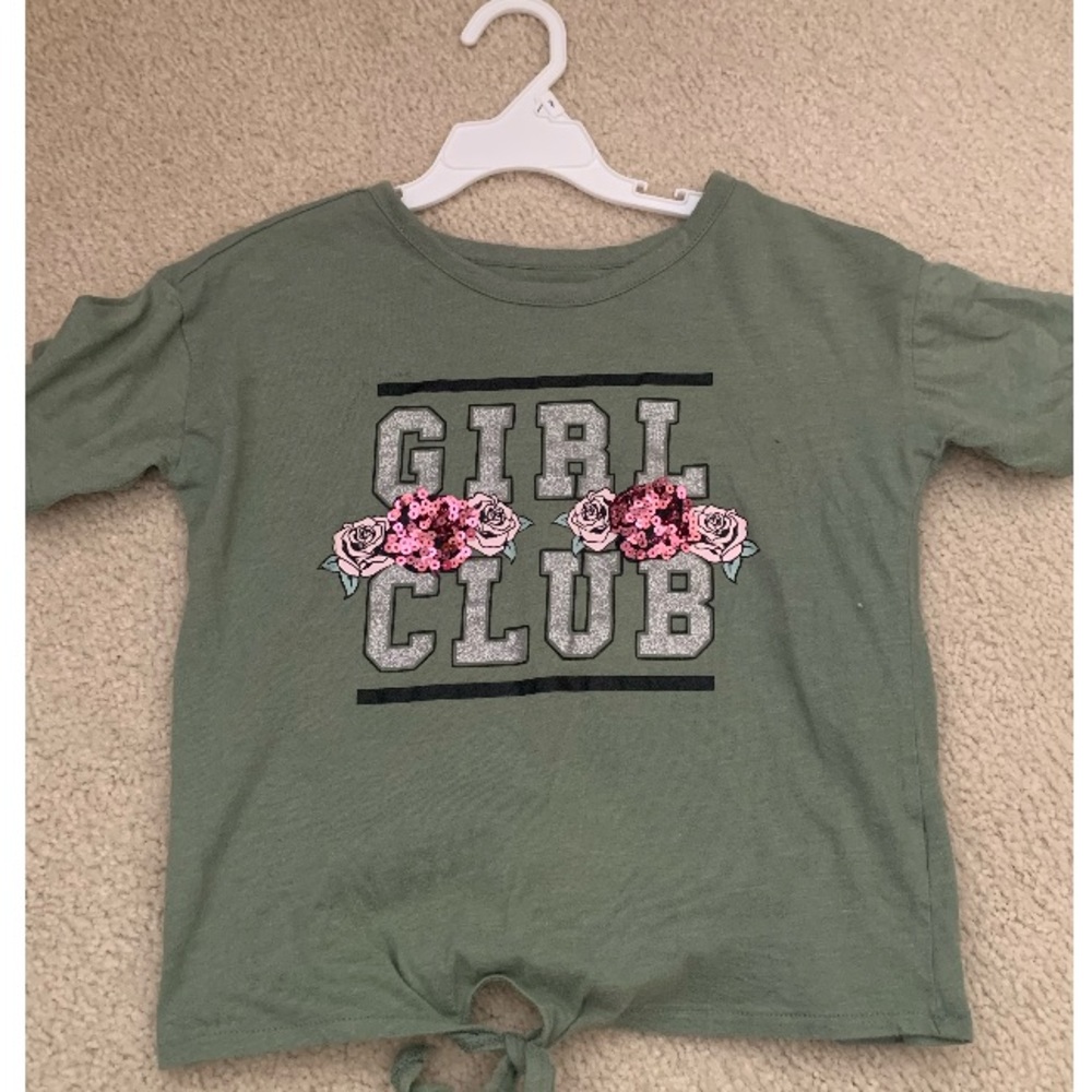 A cute green shirt with sequin material